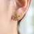 Bring a touch of whimsical, nature-inspired elegance to your style. These exquisite stud earrings feature a beautiful,...