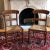 Offering a pair of antique English-style bar back chairs. These beautifully hand-constructed chairs have their original...