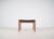 Danish stool designed by Hugo Frandsen in the 1960s. This leather-upholstered stool was manufactured by Spøttrup Møbler....