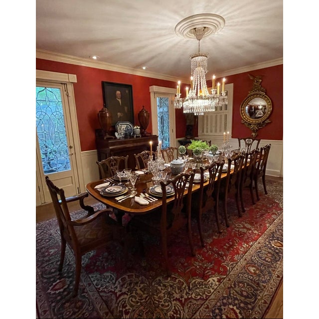 Hard to find, set of 12 solid mahogany dining chairs, consisting of 10 side chairs and 2 arm chairs, hand carved in the...