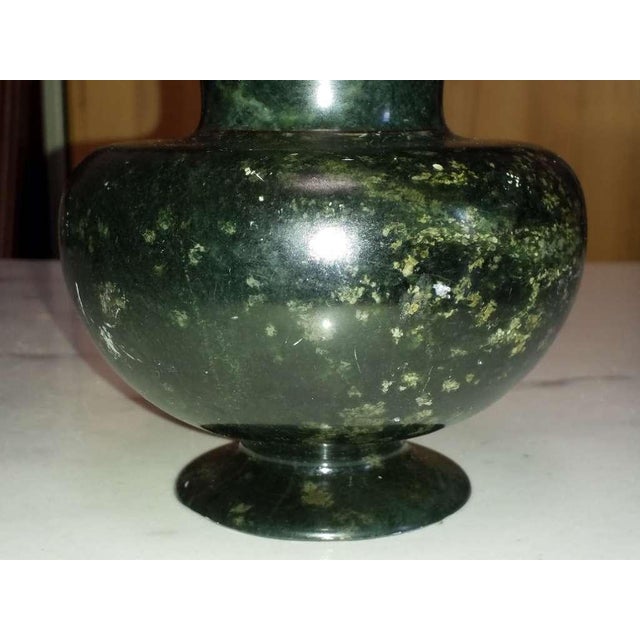 Antique Spinach-green hardstone vase of baluster form, finely carved and hand-polished, featuring a broad flared neck and...