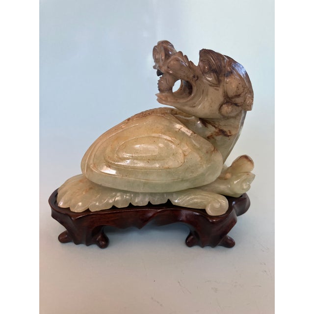 A wonderful Chinese Dragon Sculpture with stand. The rich mint colored jade, contrasts agains the light green and darker...