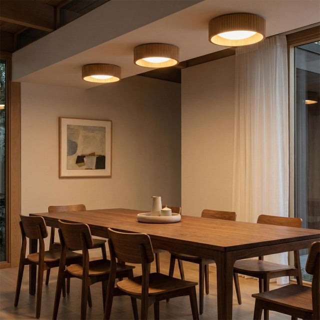 Originally designed by Peter Morelli in 1962, the Tambo 14" Flush Mount Ceiling Light in Natural Ash reflects iconic mid-...