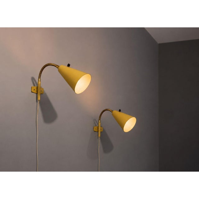 AJH, Swedish Mid-Century Modern, Adjustable Wall Lights or Sconces, Lacquered Metal, Brass, Sweden, 1950s A pair of soft...