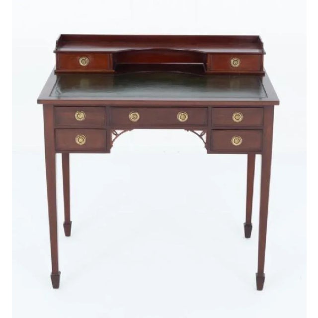 Mahogany Georgian revival Bonheur du Jour desk Circa 1920 This bonheur du jour stands upon tapered legs with spade feet...