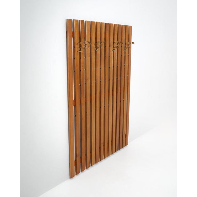 A rare and architecturally conceived wall-mounted coat rack designed by Gianfranco Frattini in the 1950s, this model...
