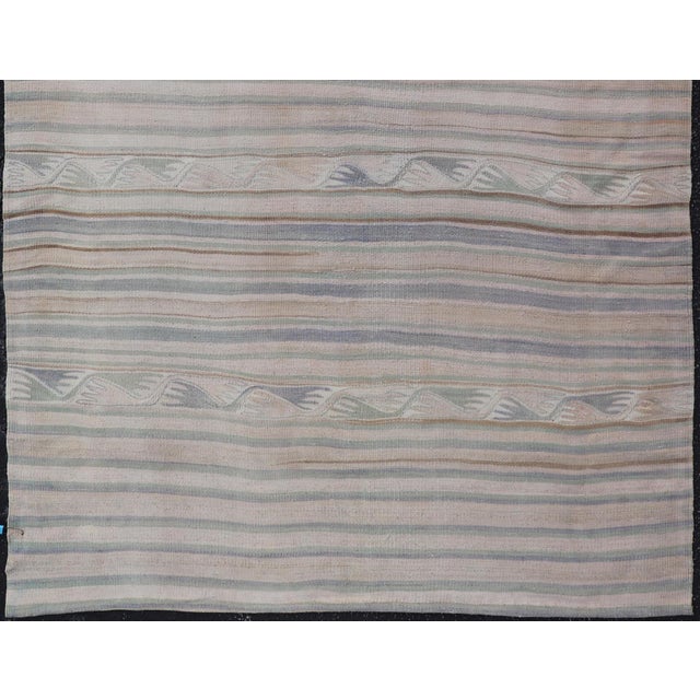 Measures: 4'5 x 6'1 Vintage Turkish Kilim with Soft Blue, Sage, and Sand Striped Design. Keivan Woven Arts / rug/EN-15649,...