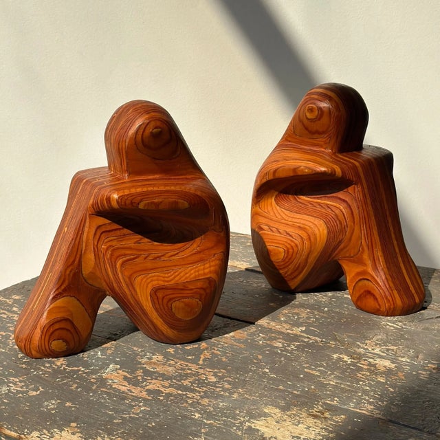 Vintage Laminated Wood Figural Bookends by Robert Hargrave, Circa 1970s-80s. This figural pair is composed of layers of...