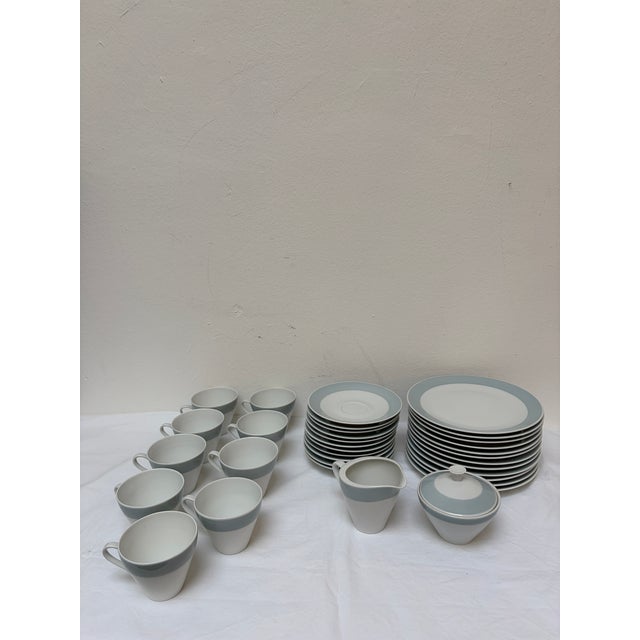 The set includes: 11 saucers, 9 cups, 12 plates, 1 sugar bowl, 1 milk jug This piece has an attribution mark, I am sure...