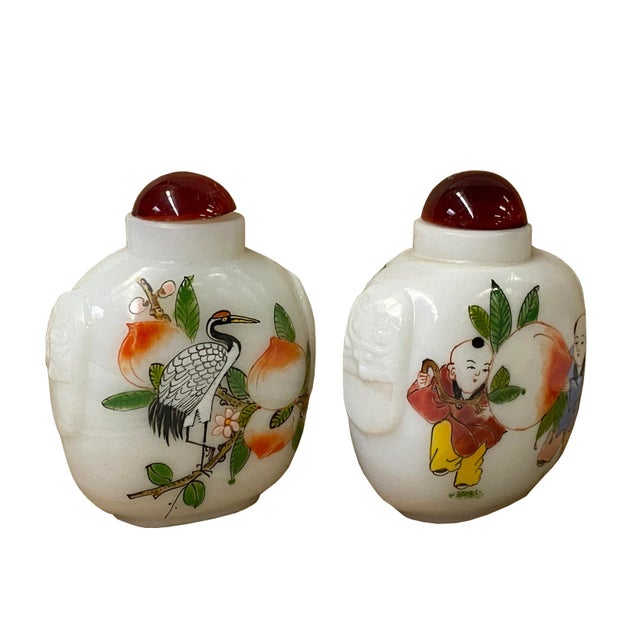 Lot of two - White glass with printed old man kids , cranes and flower art snuff bottle. Unique with character, it is a...