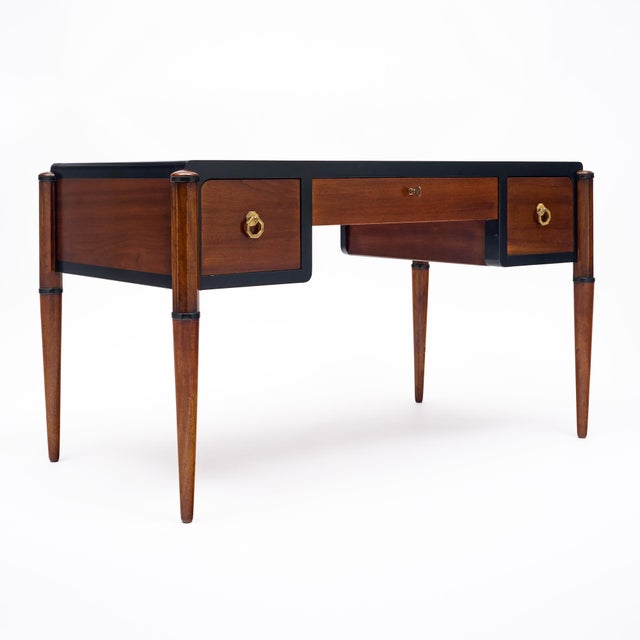 Writing desk from the Art Deco period in France. This piece is made of solid wood construction, primarily mahogany. It...