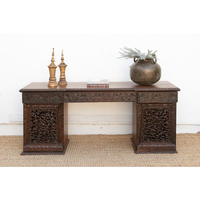 This monumental 72-inch executive desk is a rare masterpiece of Anglo-Indian furniture, representing the pinnacle of the...