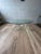 A striking vintage coffee table with a flowing, ribbon-like Lucite base and an oval glass top. The looping acrylic form...