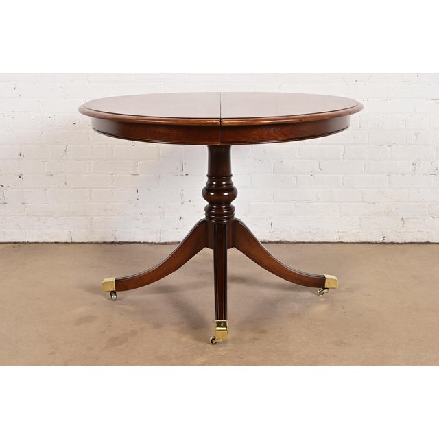 An exceptional Georgian or Regency style pedestal extension dining table, center table, or breakfast table In the manner...