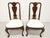 A pair of Queen Anne style dining side chairs by Hickory Chair. Solid mahogany with a carved shell to center of arched...