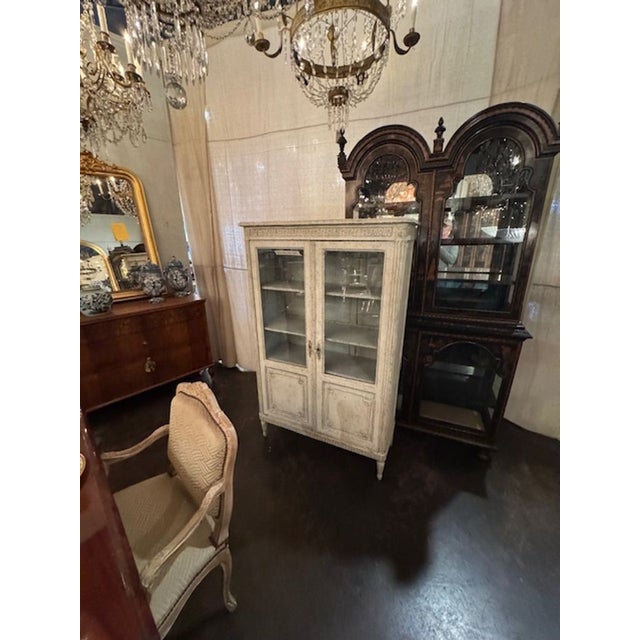 19th century French Louis XVi carved and painted display cabinet. Circa 1860. A fine addition to any home! 40w x 16d x 64h