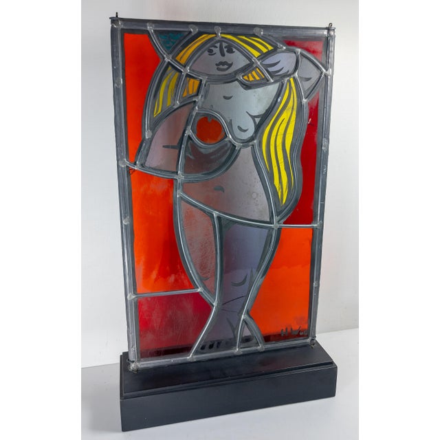 We are selling this cool mid century modern stained glass window panel. This artist panel has cool figure of a standing...