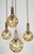 Organic globe fixture by Doria Lighting co. The polished brass fixture supports 2 different size organic style globes of...