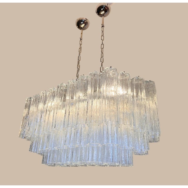DUTIES FREE An exceptional Italian Murano chandelier composed of 72 stunning clear glass tubes arranged in an elegant...