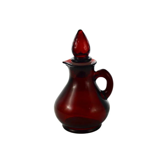 Vintage deep ruby red glass cruet petite pitcher with a conical tip glass stopper and tight fit rubber plastic gasket....