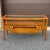 A 1990s Modern or Contemporary Lane Furniture tiered console or sofa table featuring a wood and glass top, one drawer in...