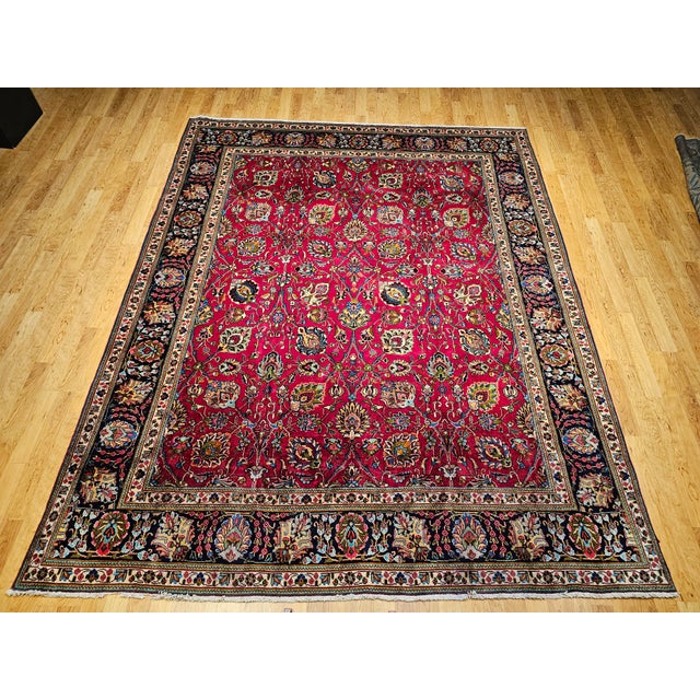 Bring cheerful elegance to your home with this magnificent Vintage Persian Tabriz room size rug, hand-knotted circa the...
