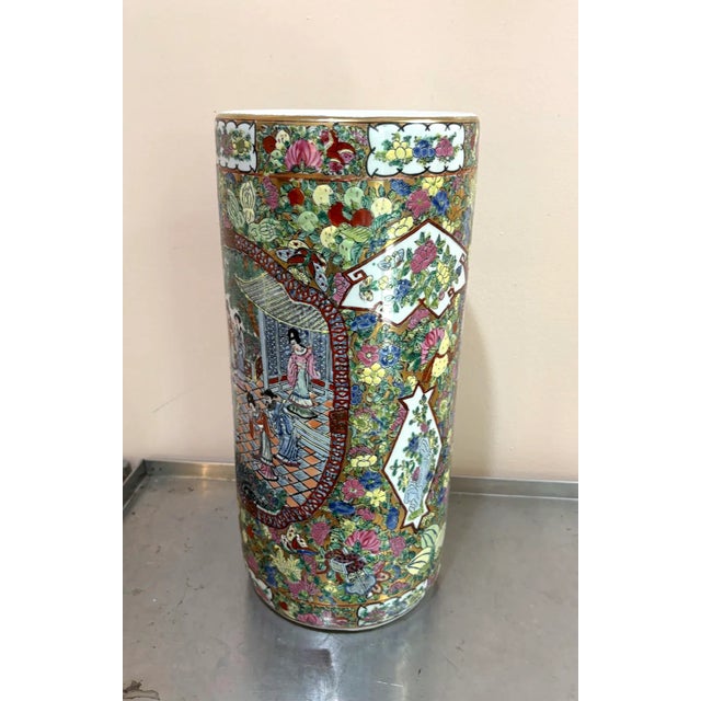 Hand-painted Chinese ceramic gilt/floral/lady scene umbrella stand. Some mild discoloration spots to inside of vessel as...