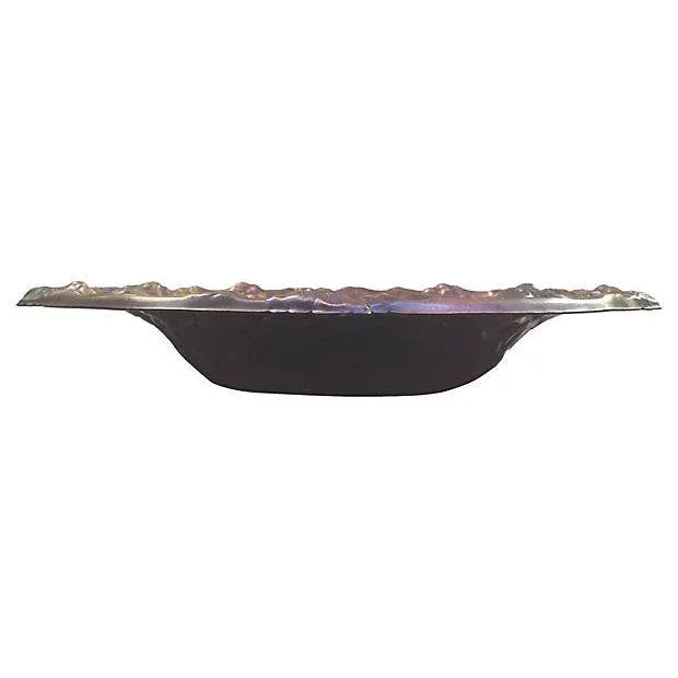 Copper repousse decorative bowl with a stylized Art Nouveau pansy and leaf motif with a wide flared rim. The copper bowl...