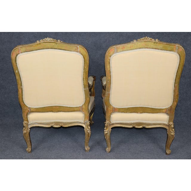 Pair of Late 19th-Century French Louis XV Style Giltwood Armchairs (Bergères) Immerse your space in the timeless elegance...