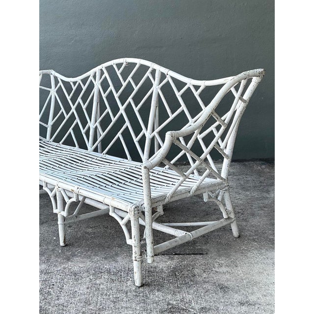 This exquisite vintage Chinese Chippendale settee is a masterpiece of coastal elegance and architectural form. Defined by...