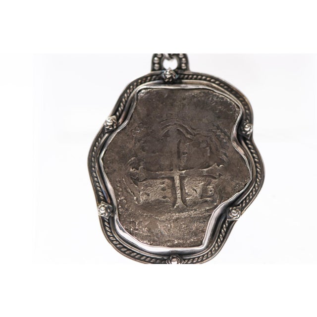 A "8 Reales" High Grade Silver Coin minted in Mexico from the famed "Concepcion" ship wreck of 1641, trimmed with 825...