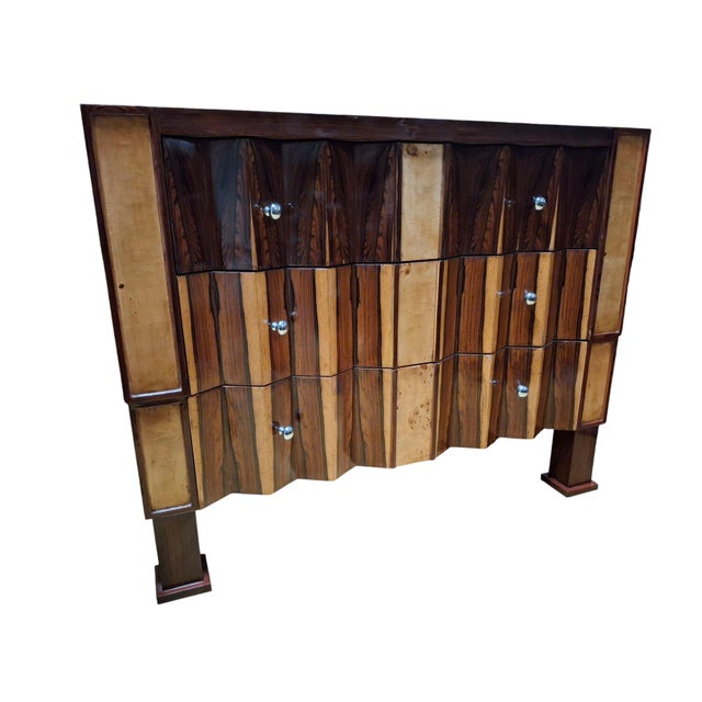 Pair of art deco rosewood and mixed wood chest of drawers/commodes, each consisting of three drawers with a zigzag drawer...