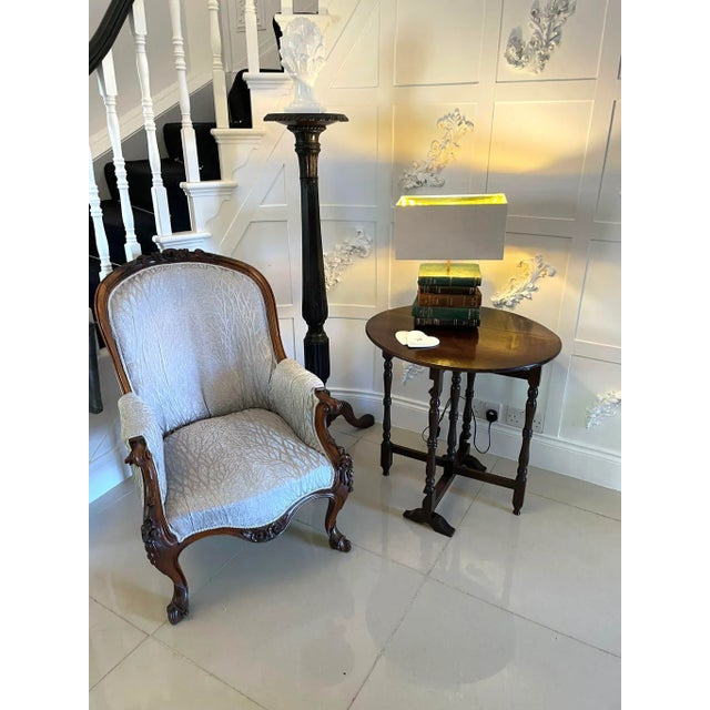 Unusual antique victorian quality oak coaching table having a quality oak oval tilt top supported by an unusual swivel...