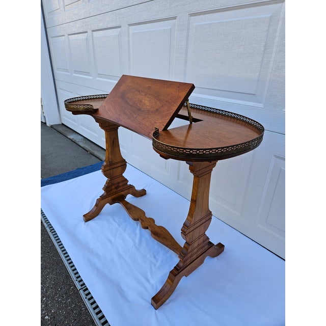 This wonderful petite writing desk or music stand has a pierced brass gallery. The top features a central section that can...