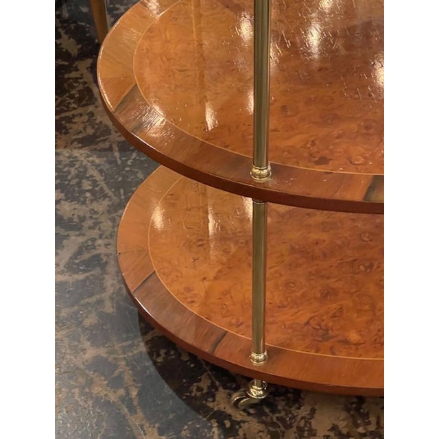 The MCM Walnut and Brass Occasional Table is a stylish and versatile piece of furniture. This table is designed in a mid-...