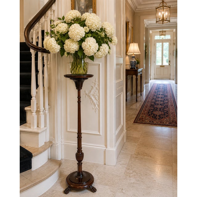 A fine quality antique Victorian carved mahogany torchere of elegant proportions. Standing on a substantial circular...