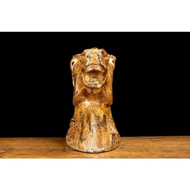 This unique sculpture depicts a horse's head with painted eyes wide open. The sculpture weighs just under six pounds and...