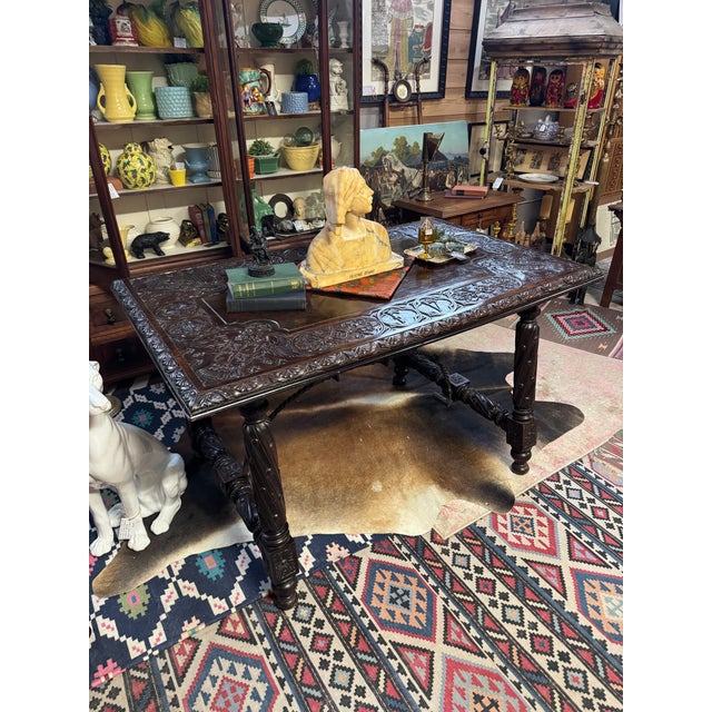 Heavily carved 19th century Spanish or Gothic revival style library table. Would make a stunning executive desk, kitchen...