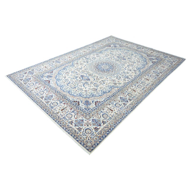 This noble Nain 9La oriental rug with a generous size of 359 x 252 cm impresses with its classic beauty and the finest art...
