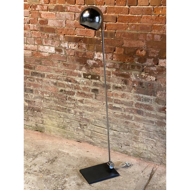 Chrome articulating eyeball floor lamp by Robert Sonneman. Black powder coated iron base that support a slender chrome...