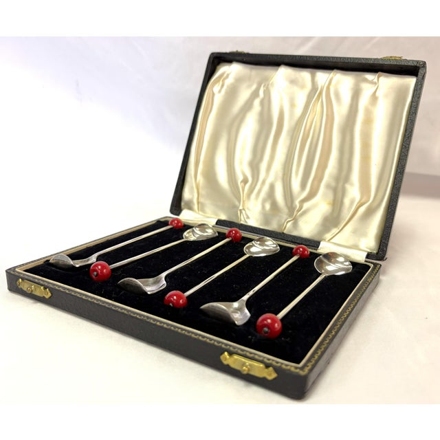 Fun set of six muddling spoons the 1920's. These silverplated spoons have a great Art Deco design featuring a red Bakelite...