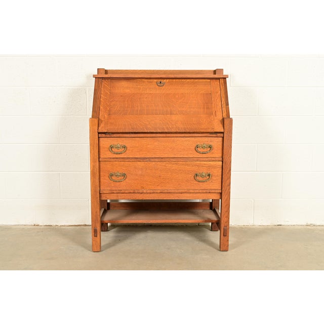 An exceptional antique Mission or Arts & Crafts period drop front secretary desk By Lifetime Furniture USA, Circa 1910...