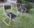 Mid century pair of painted iron and wood garden or patio chairs.
