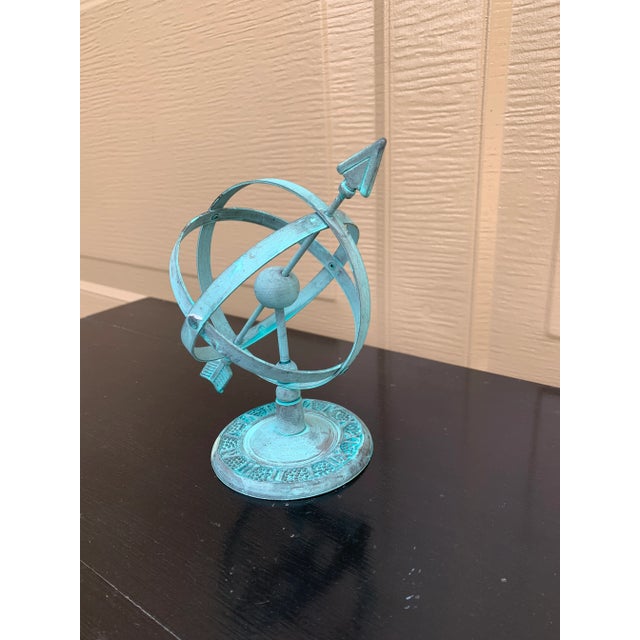 A beautifully crafted iron armillary sphere, evoking the timeless elegance of classical European gardens. Pieces like this...