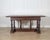 An exceptional Lombard Louis XIV table from the first half of the 17th century, masterfully carved in solid walnut. This...