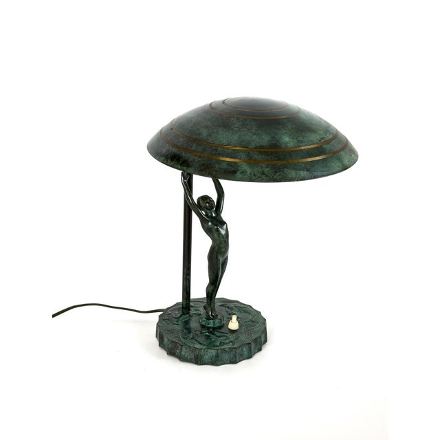 A rare and highly decorative Swedish Grace table lamp produced by Malmö Metallvarufabrik, Sweden, circa 1930. This...