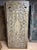 An exquisite vintage door showcasing intricate hand-carved floral lattice work, left in its natural wood finish to...