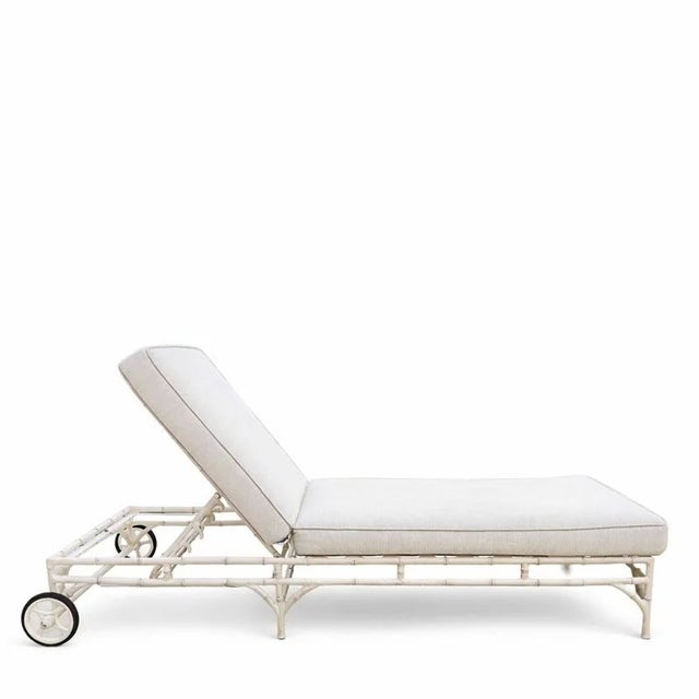 A set of four outdoor chaise lounges by Michael Taylor designed with a sculptural bamboo-inspired metal base finished in...