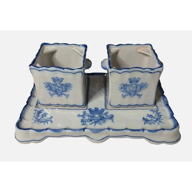 The product is an antique inkwell and tray set made by Emile Galle in France during the late 18th century. This antique...