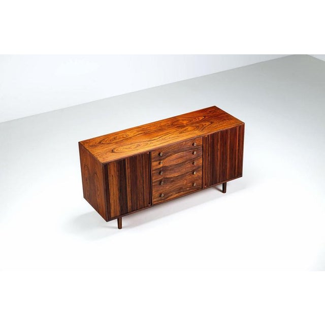 Beautiful sideboard by unknown designer in rosewood with tambour doors, Denmark, 1960. A very rare and beautifully...
